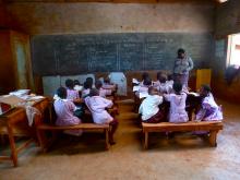 A student visits her homestay mother's classroom